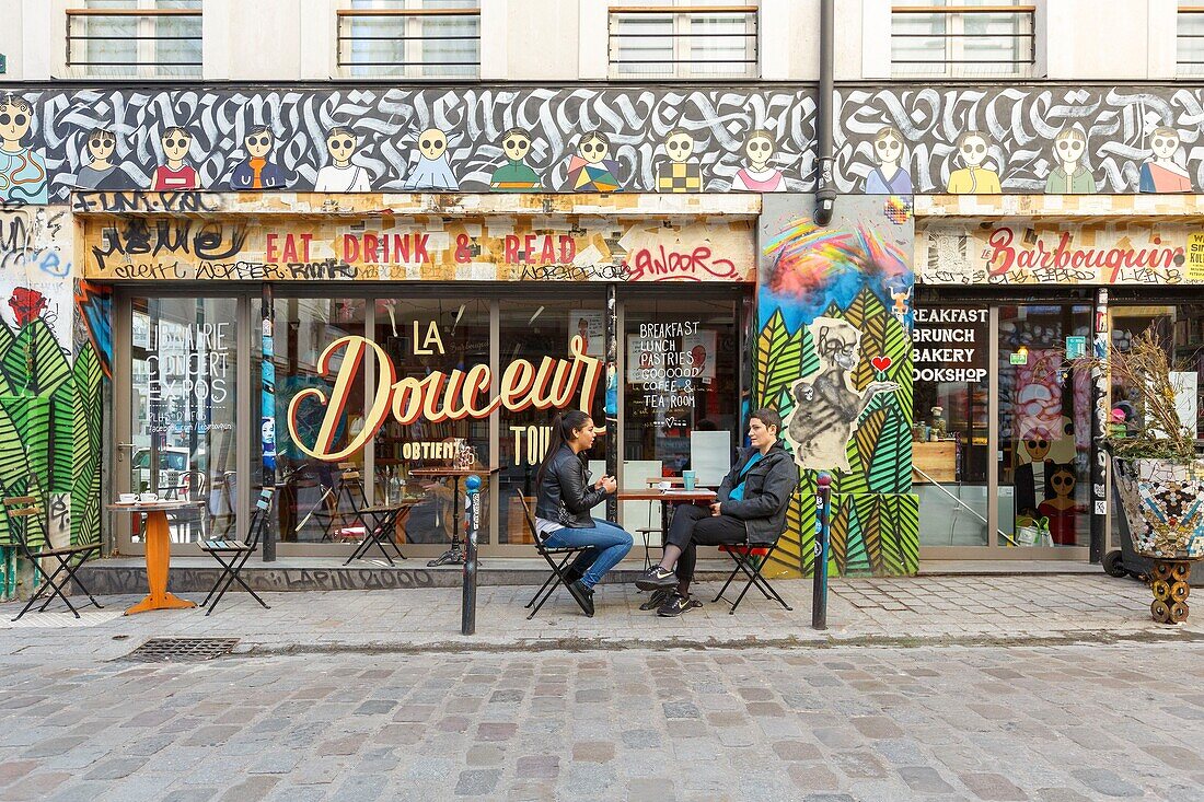 France,Paris,street art,graffitis and murals in Rue Denoyez,the terrace of the Barbouquin,cafe and bookstore