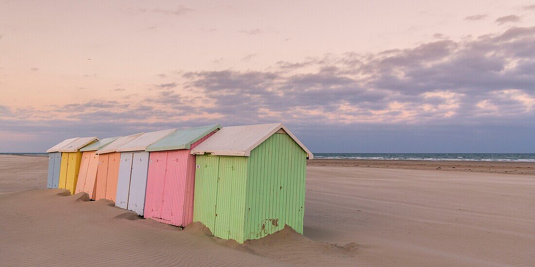 France,Pas de Calais,Berck sur Mer,beach cabins in Berck sur Mer at the end of the season,the wind has swept the beach and erosion gnaws the support of the cabins that rock and give an off season atmosphere