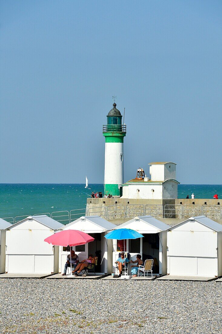 France,Seine Maritime,Le Treport,beach cabins on the pebble beach,jetty and lighthouse