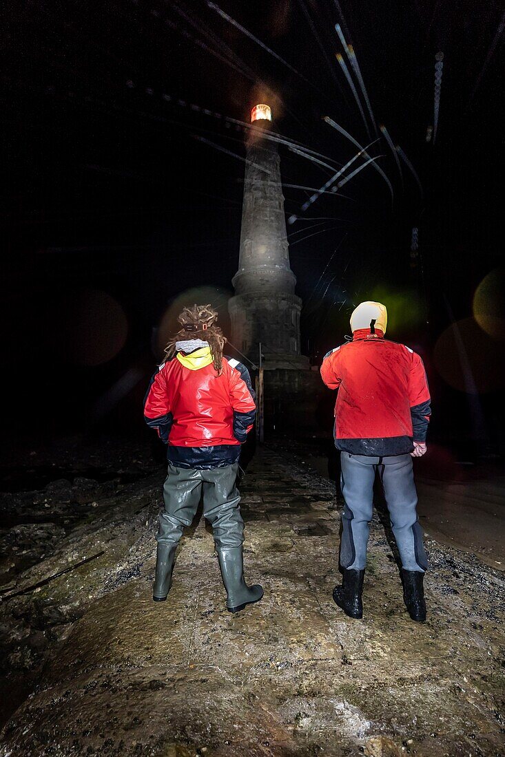 France,Gironde,Verdon sur Mer,rocky plateau of Cordouan,lighthouse of Cordouan,listed as Monument Historique,lighthouse keepers on the rocky plateau at night at low tide