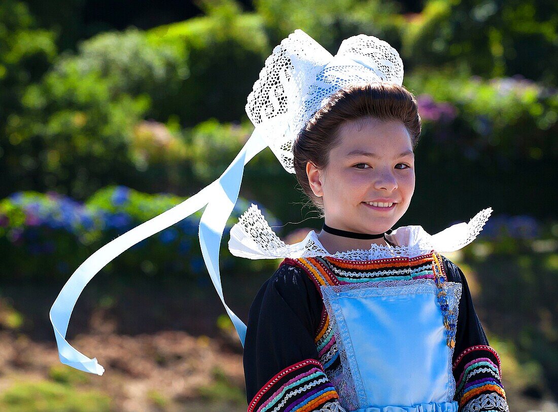 France,Finistere,parade of the 2015 Gorse Flower Festival in Pont Aven,child in Pont Aven headdress and costume