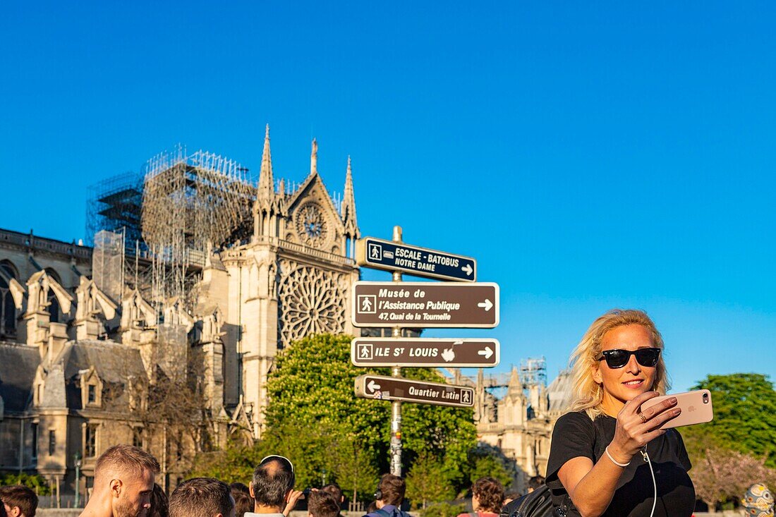 France,Paris,area listed as World heritage by UNESCO,Ile de la Cite,Notre Dame Cathedral,Tourist Selfie