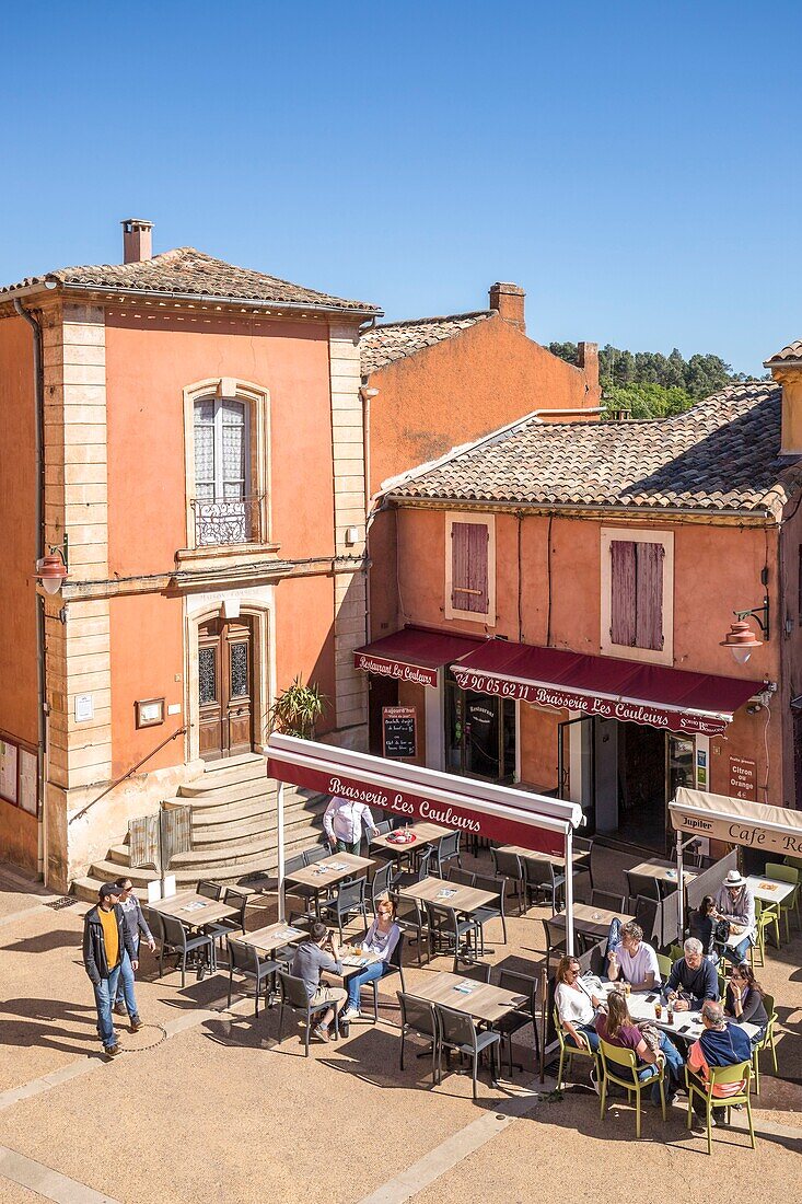 France,Vaucluse,regional natural park of Luberon,Roussillon,labeled the most beautiful villages of France,town hall square