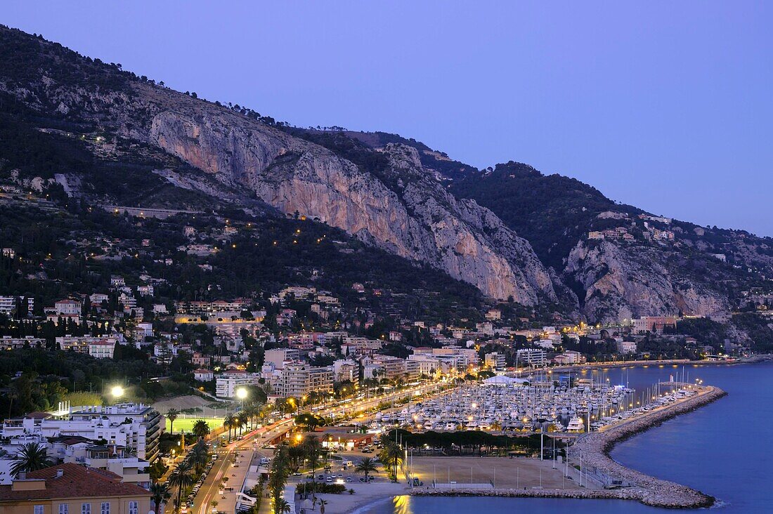 France,Alpes Maritimes,Menton,Garavan Bay,the port,a moonlit evening in early spring,in the background Italy