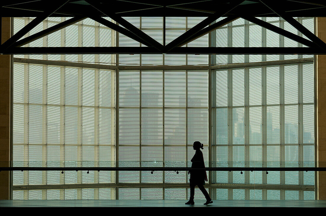 Qatar,Silhouette of woman against large window in Museum of Islamic Art,Doha