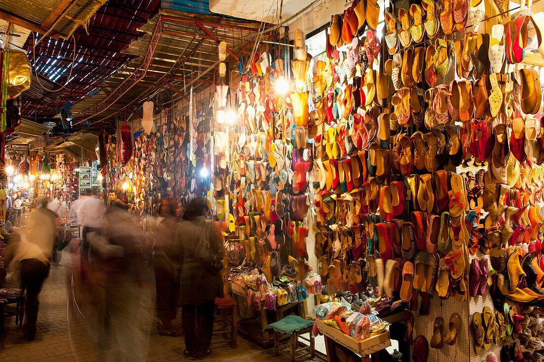 Morocco,People in front of shoe stalls in souk,Marrakesh