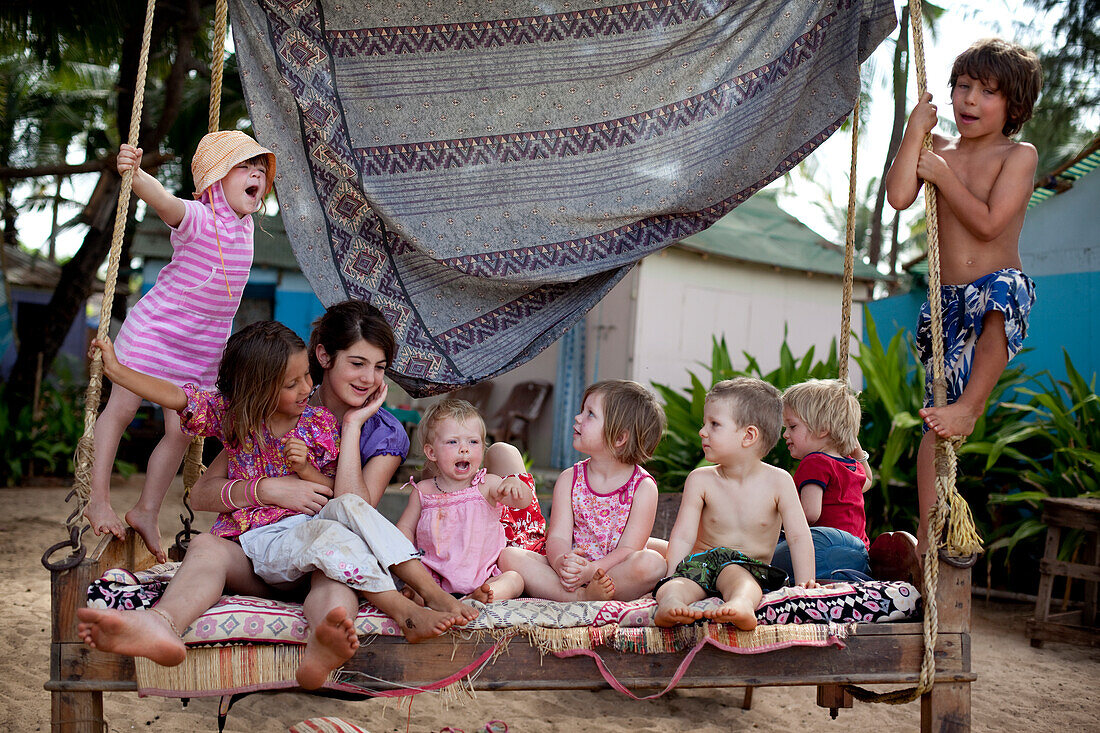 Kiki Lett aged 5,(left) and friends on holiday together play pirates on a swingbed (left to right) kiki Lett,Eve Grey,Isabella Rollason,Myonie Reynolds,Lula Issac,Rudi Mchugh,Ivan Cumin,and Freddie Grey ) in Solitude Restaurant and Huts,Patnum Be
