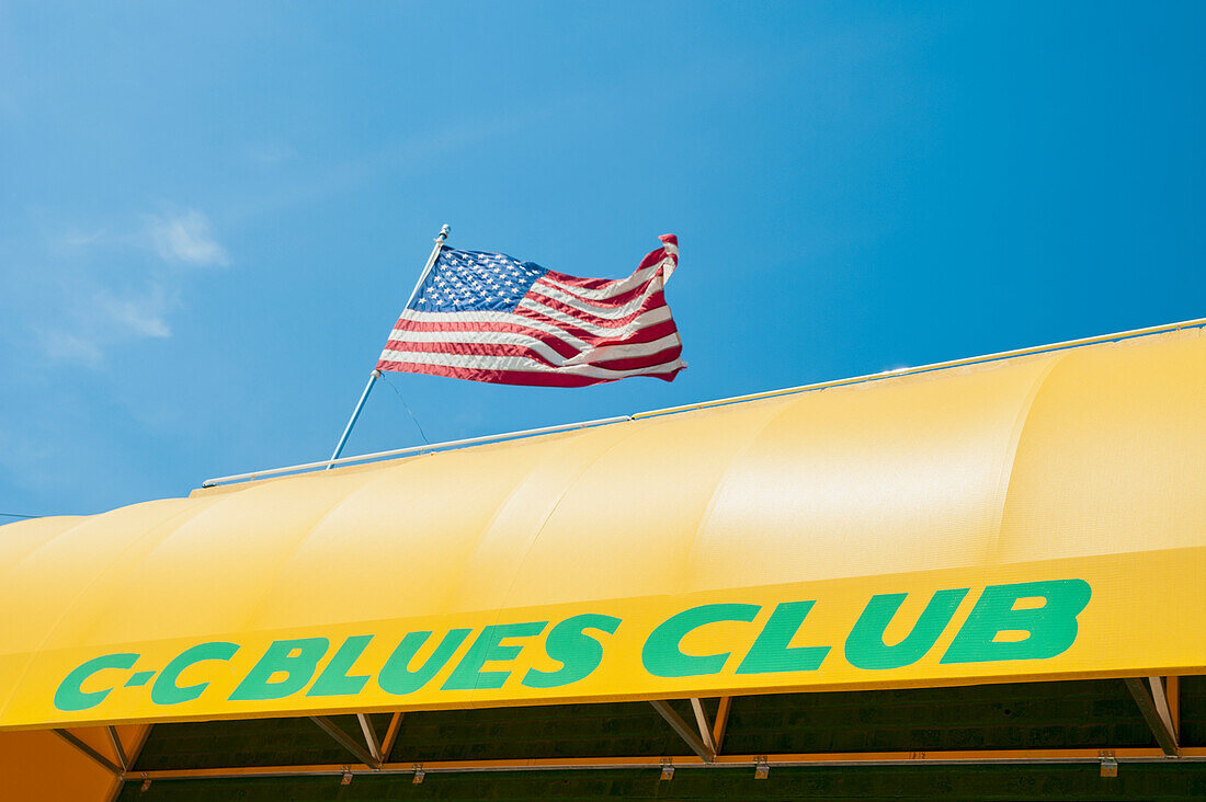 USA,Tennessee,US Flag on top of CC Blues Club,Memphis