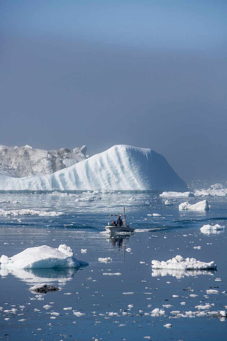 Greenland,Icefjord,Ilulissat (Jakobshavn),Unesco World Heritage Site,Fishermen going out to sea