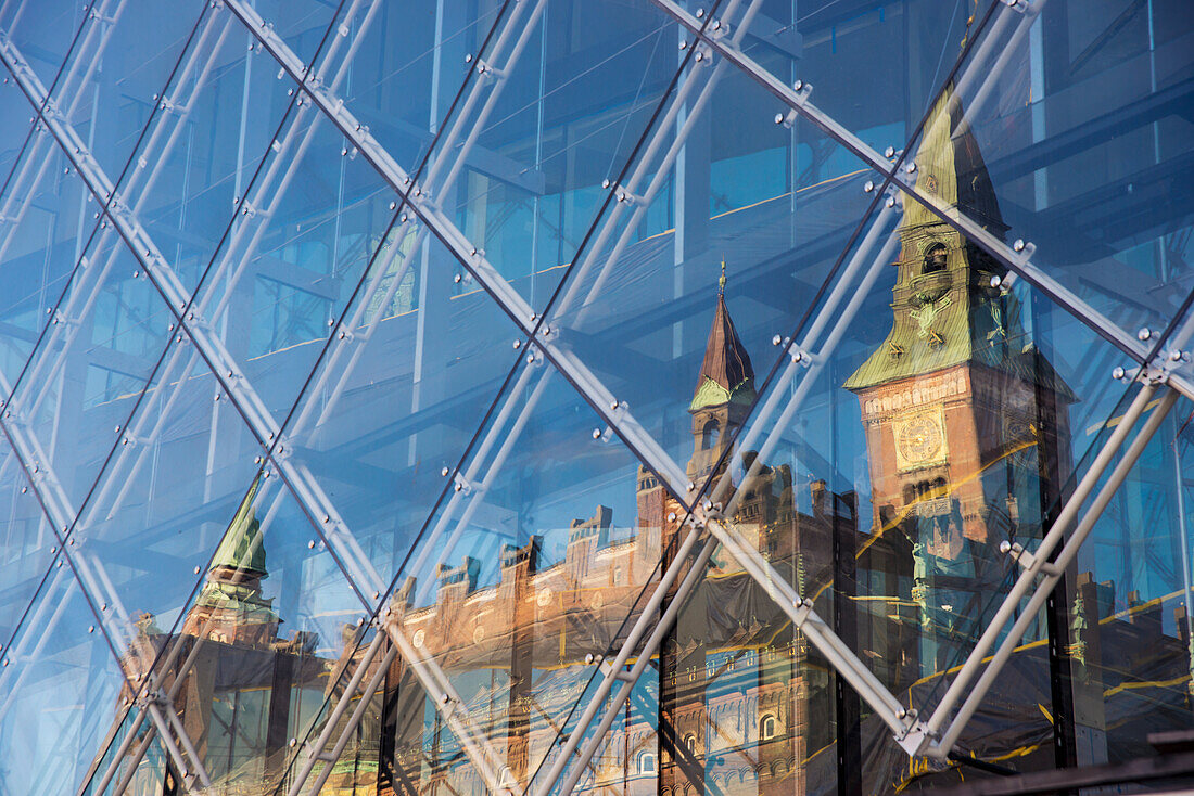 Denmark,Town Hall's reflection in modern glass building,Copenhagen