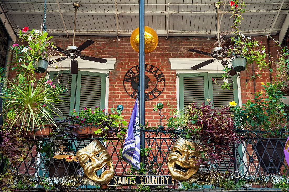 USA,Louisiana,French Quarter,New Orleans,View of decorated balcony with carnival mask and flowers