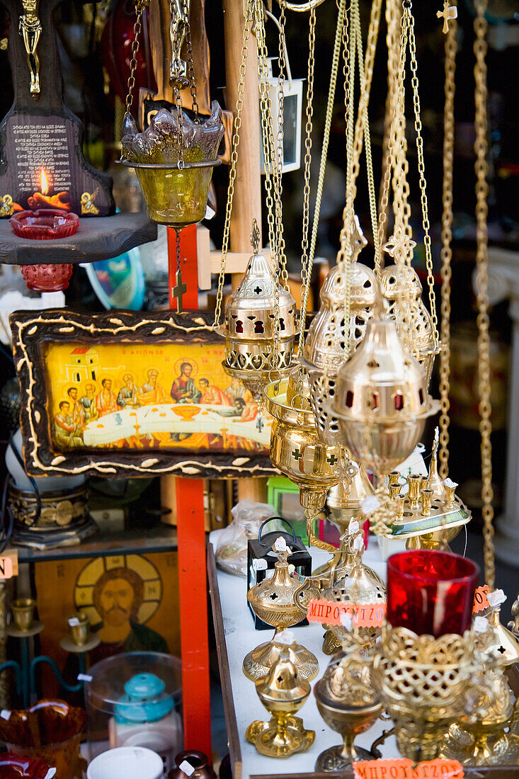 Greece,Icons censers and other religious items for sale at market stall,Thessaloniki