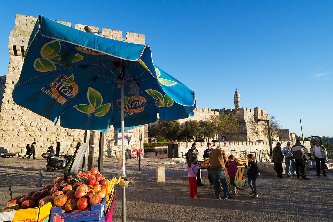 Israel,Jerusalem Old City,Jaffa Gate,Jerusalem,Pomegranate juice stall with Citadel of David in background