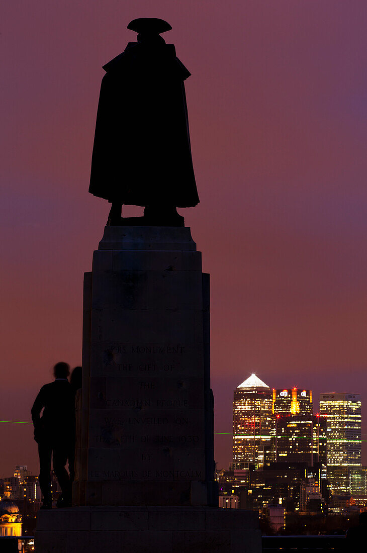 General Wolfe Statue In Greenwich Park At Night With Canary Wharf In Background,London,England,Uk