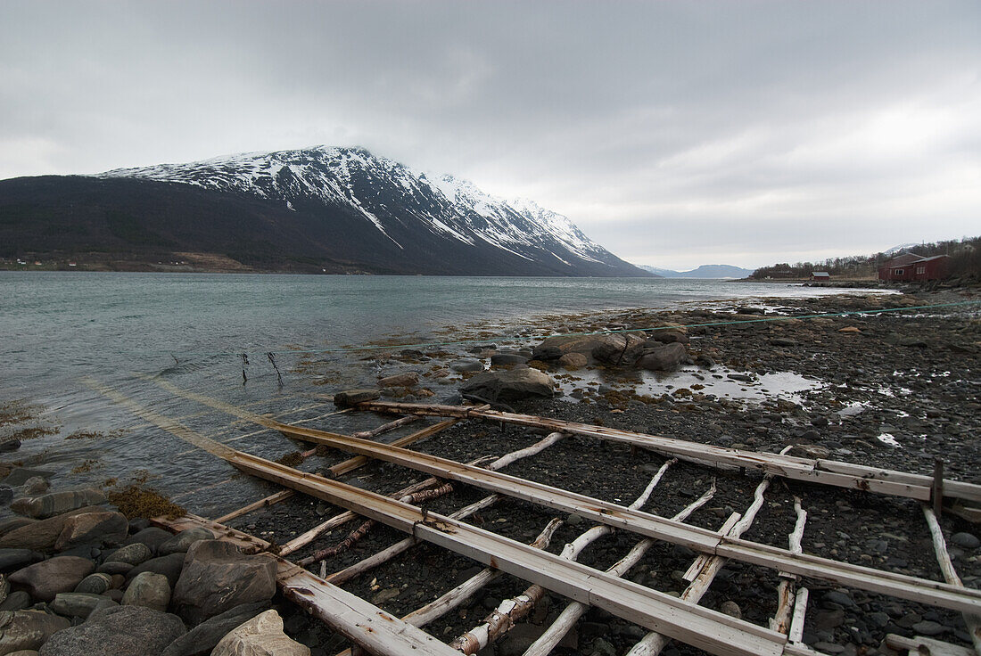 Landscape With Coastline And Mountain Covered With Snow,Fjord,Norway