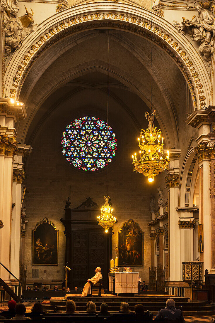 Priest Sitting In Chair During Service In Church,Valencia,Spain