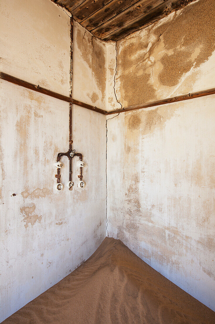 Outlet And Sand In Abandoned House,Kolmanskop Ghost Town,Namibia