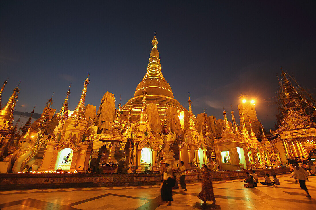 Visitors Walk Around Shwedagon Pagoda At Sunset,Yangon,Burma