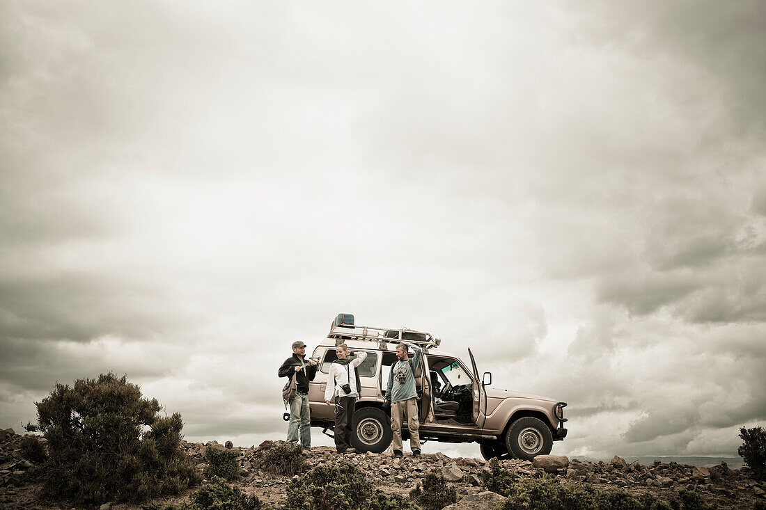 Travellers Beside Their Four Wheel Drive Vehicle In The Simien Mountains,Ethiopia