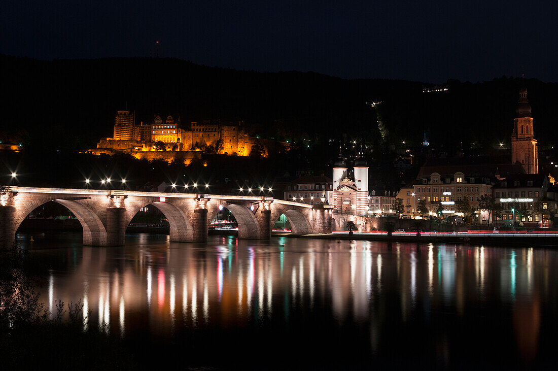 Heidelberg Castle And The Old Bridge Over River Neckar Illuminated At Nighttime,Heidelberg,Germany