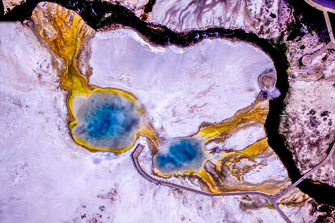 Dramatic aerial view of blue hot springs in Black Sand Basin of Yellowstone National Park,USA,United States of America