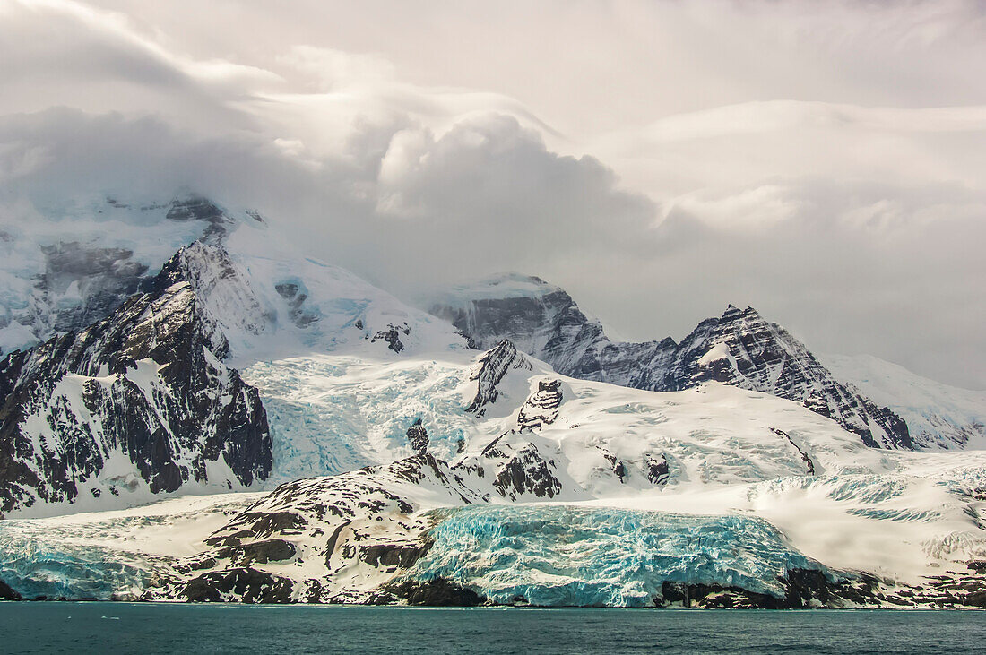 Blue ice and glaciers on the rugged rock formations of South Georgia Island in the Antarctic,South Georgia Island,Antarctica