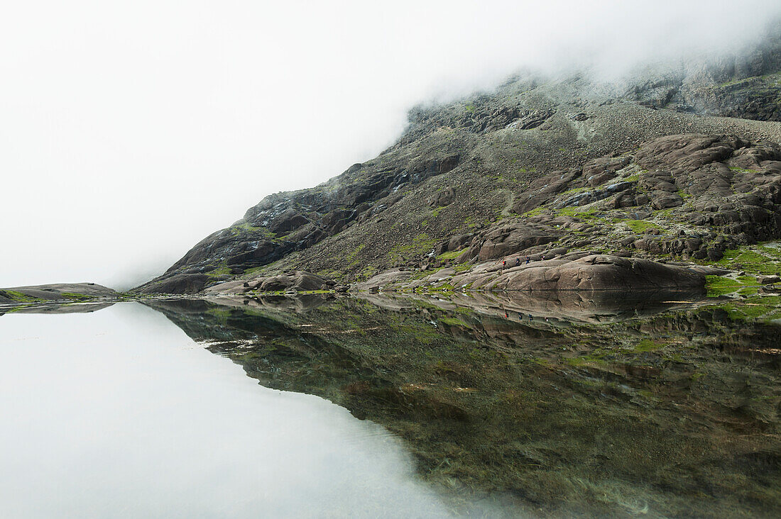 Reflections In Perfectly Still Small Lake Below Sgurr Dearg And Sgurr Alasdair In The Black Cuillin,Isle Of Skye,Scotland