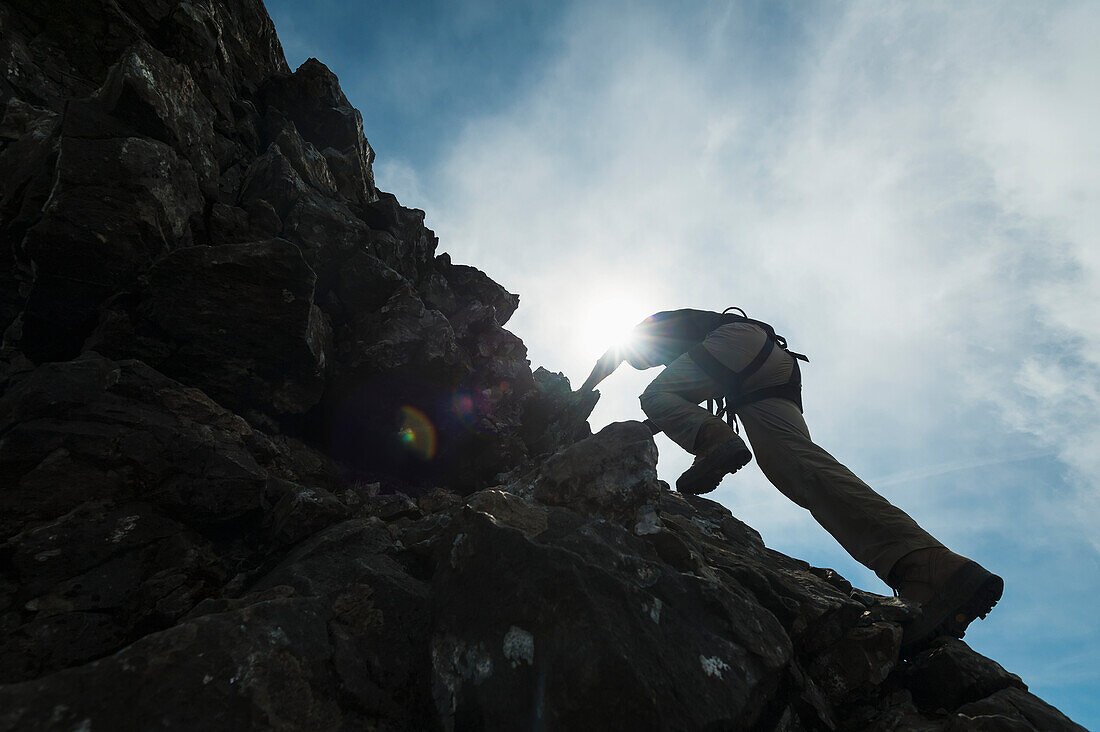 Man Scrambling Up Ridge In The Black Cuillin,Isle Of Skye,Scotland