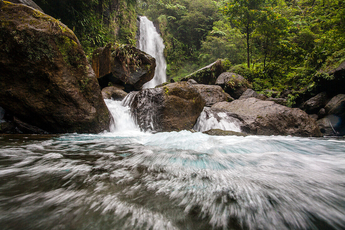 View of the rushing water,rocks and lush vegetation at Trafalgar Falls on the Caribbean Island of Dominica in Morne Trois Pitons National Park,Dominica,Caribbean