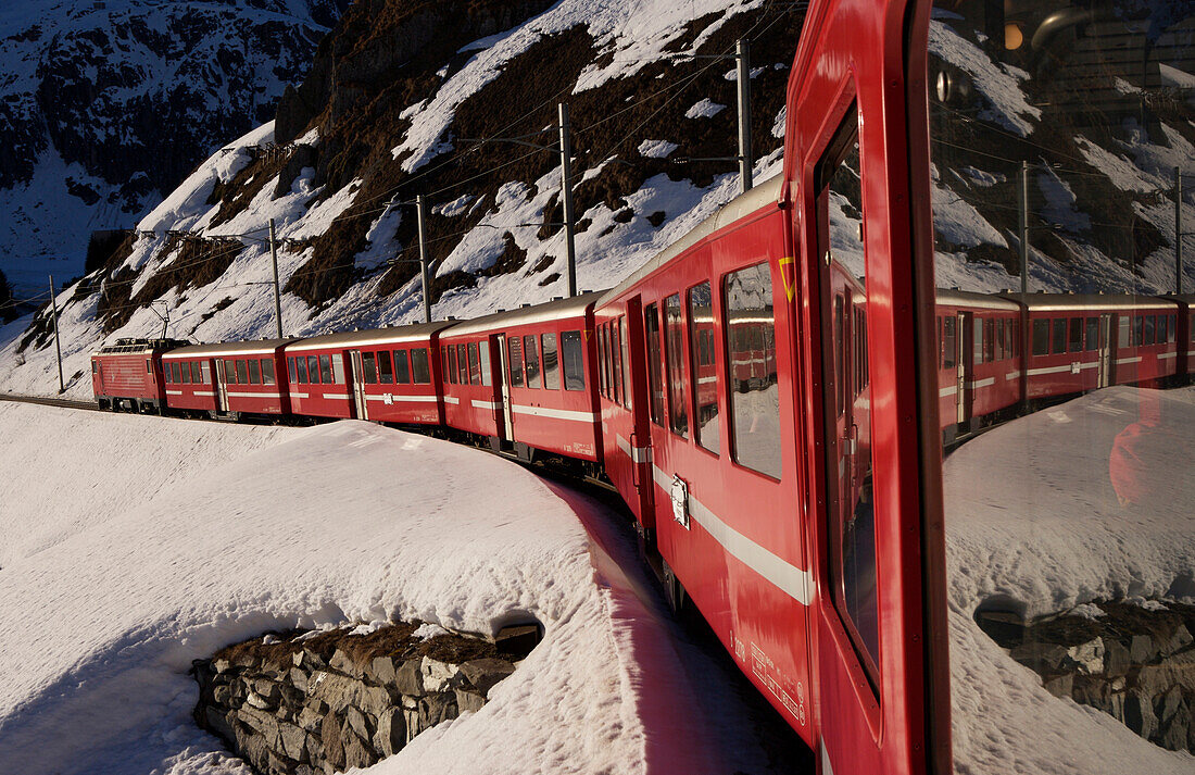 Glacier Express train in the Swiss Alps between Sedrun and Andermatt,Andermatt,Switzerland