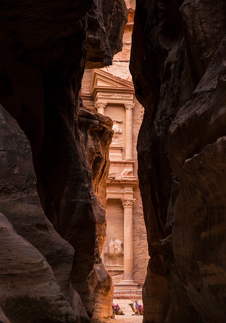 View of the Treasury,al Khazneh,viewed through the Siq or shaft,the entrance to Petra,Petra,Jordan