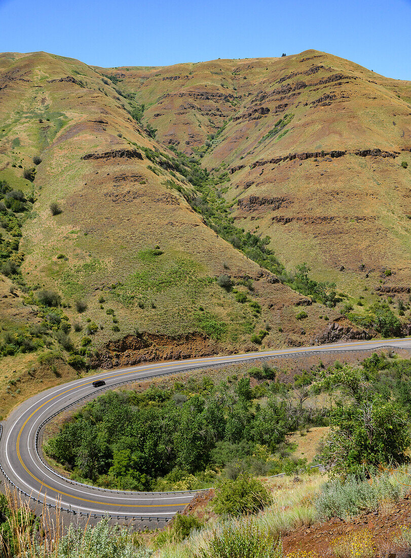 A car making the turn on a curvy section of Highway 129 in Eastern Washington near the Oregon border,Clarkston,Washington,United States of America