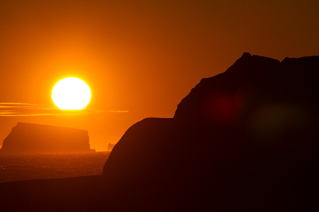 Icebergs silhouetted in the Weddell Sea at sunset,Antarctica