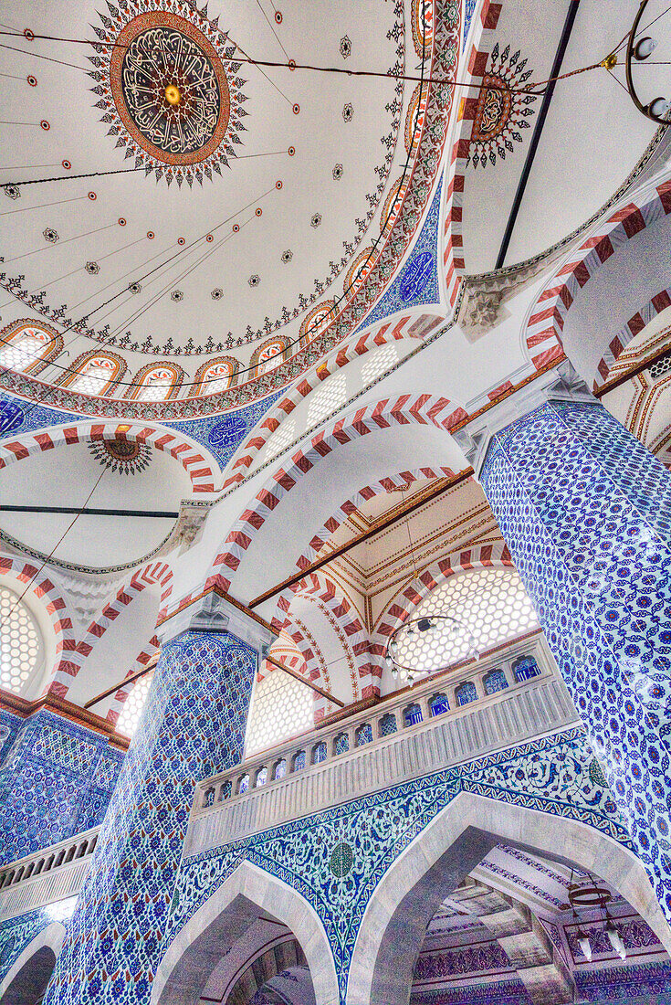 Close-up interior of the Rustem Pasha Mosque with its blue and white Iznik tiles and domed ceiling,Istanbul,Turkey