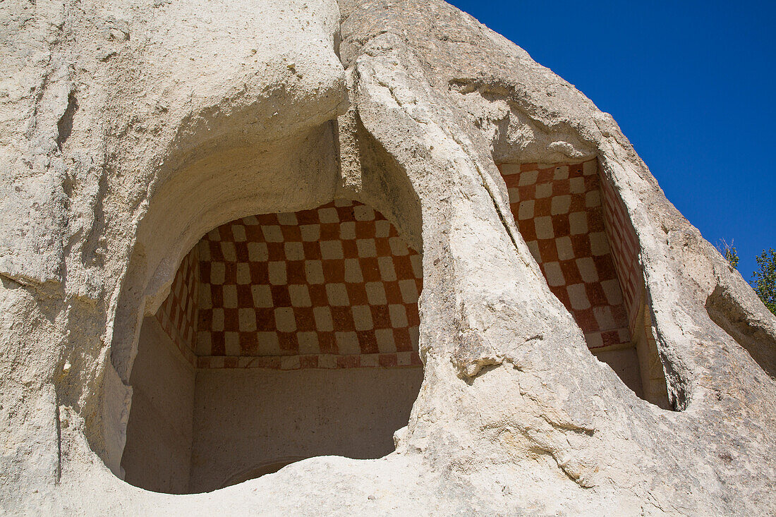 Close-up of entrance to a Cave House with painted,decorative geometric pattern on the interior wall in the town of Goreme in Pigeon Valley,Cappadocia Region,Nevsehir Province,Turkey