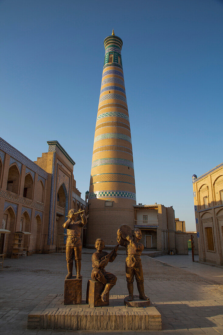 Sculpture with Islam Khoja Madrasah and Islam Khoja Minaret in Itchan Kala,Khiva,Uzbekistan