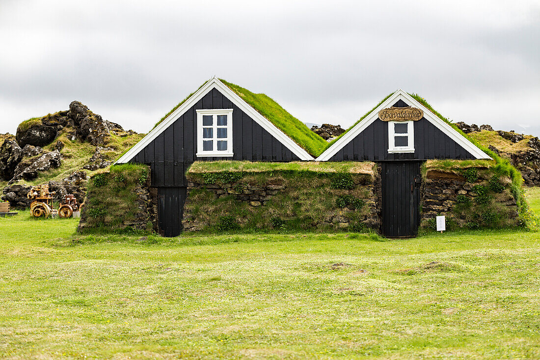 A pair of historic turf houses at a tourist attraction in Western Iceland,Iceland