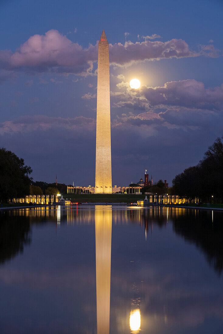 Washington Monument taken from Lincoln Monument at dusk with moon shining brightly,Washington D.C.,United States of America