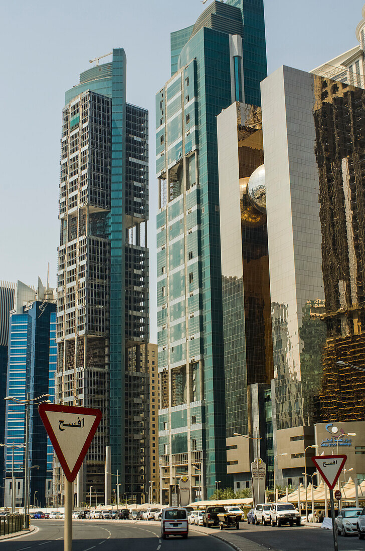 Modern skyscrapers with traffic signs and cars,Doha,Qatar