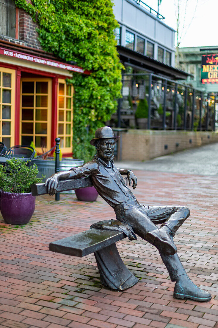 Sculpture of 'Dirty Dan Harris' (Daniel Jefferson Harris) sitting on a bench,Fairhaven,Washington,United States of America