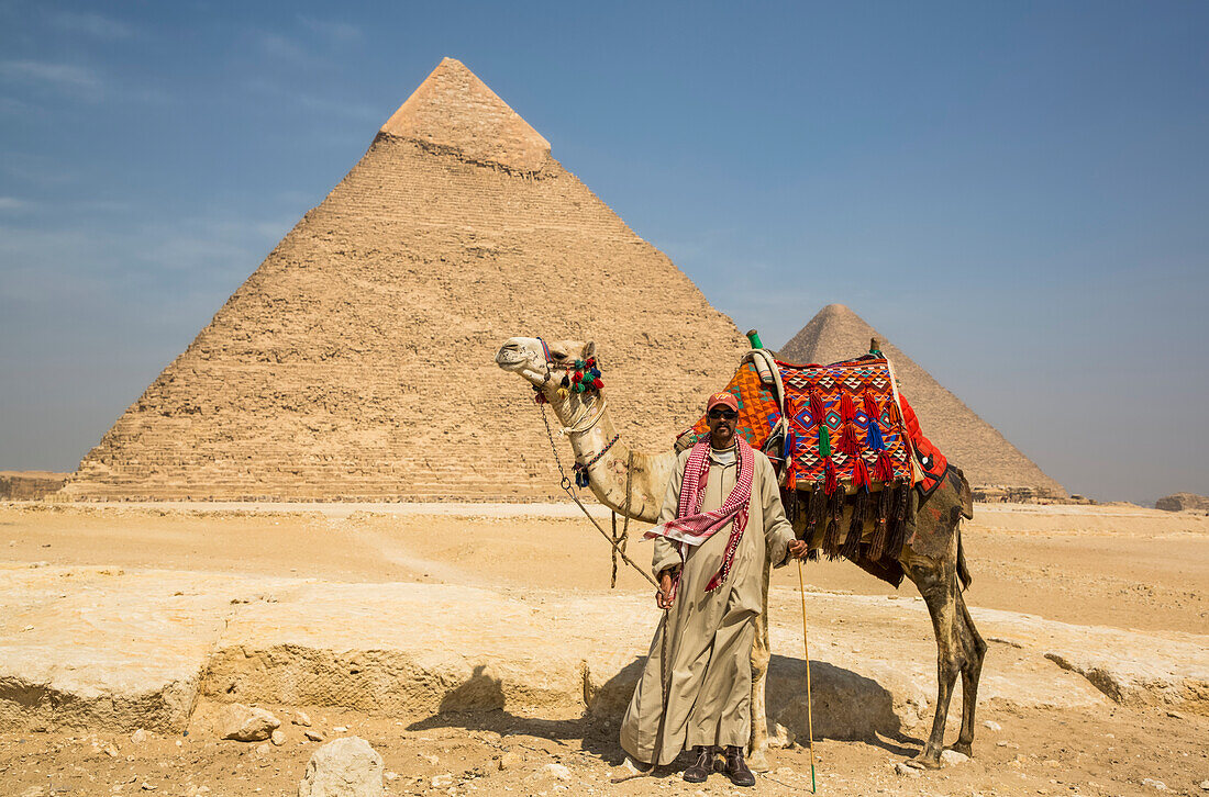 Local man with camel,Pyramid of Khafre,Giza Pyramid Complex,UNESCO World Heritage Site,Giza,Egypt