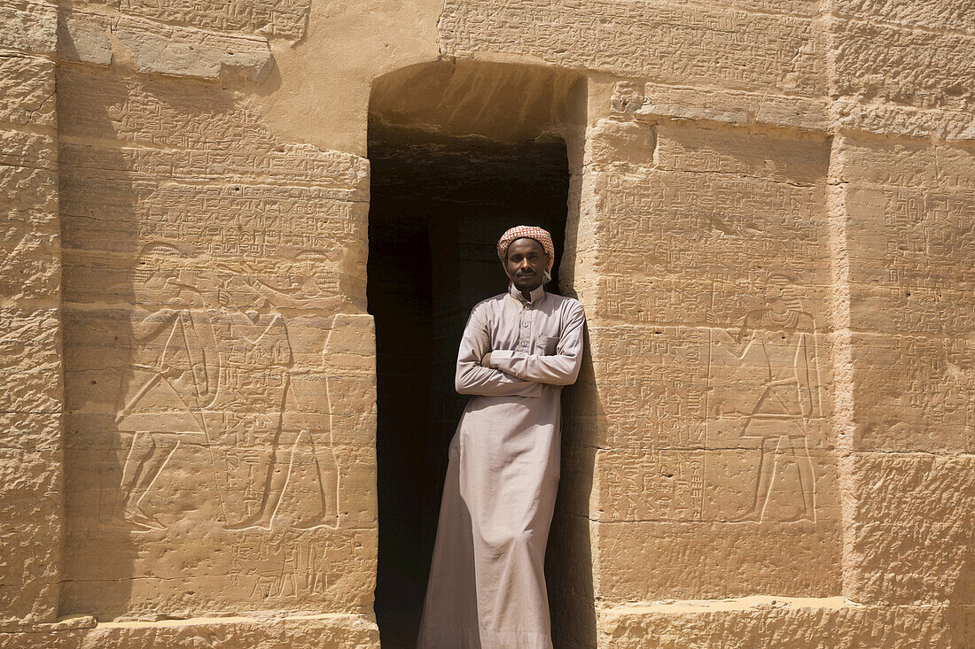 Caretaker in doorway,Entrance,Tomb of Harkhuf,Tombs of the Nobles,Aswan,Egypt