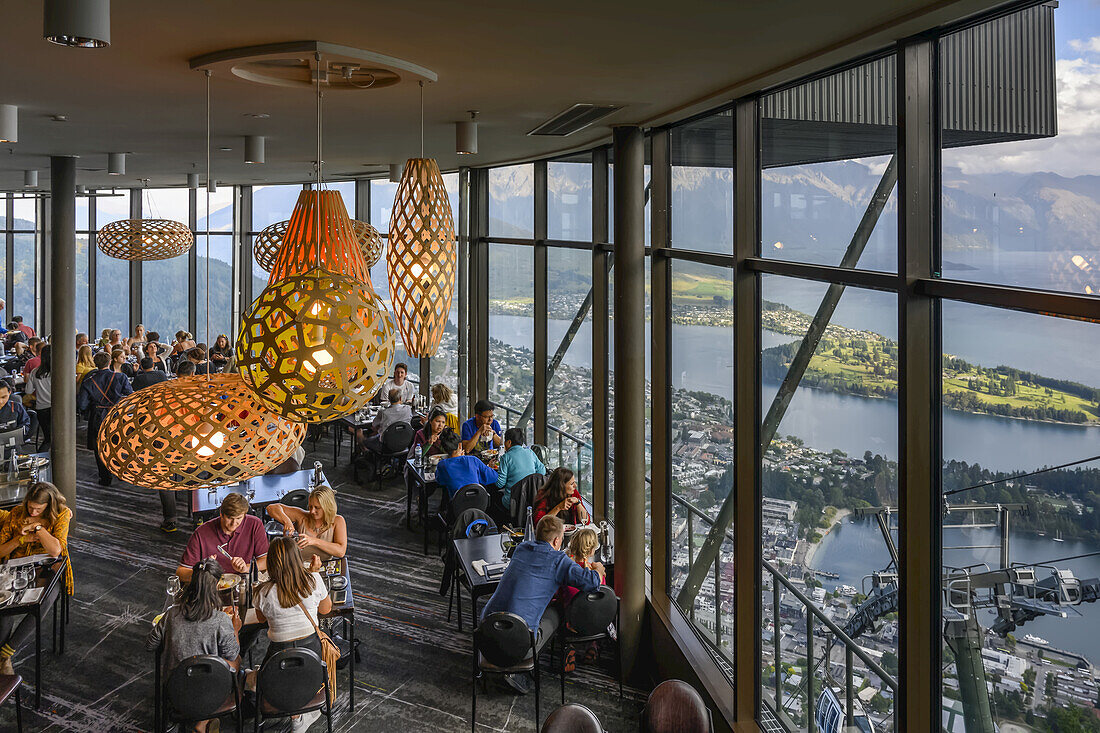 Restaurant with glass walls overlooking Lake Wakatipu,Queenstown,Otago Region,New Zealand