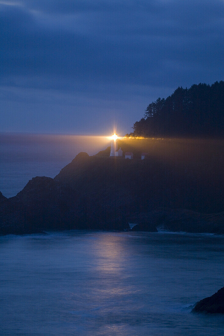 Heceta Head Light illuminated at dusk,Heceta Head,Oregon coast,Oregon,United States of America