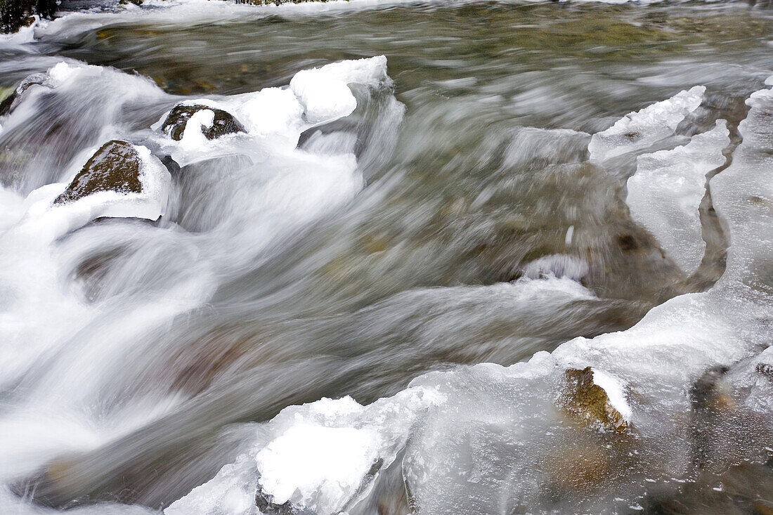 Water flowing over snow and ice-covered rocks,Columbia River Gorge,Oregon,United States of America