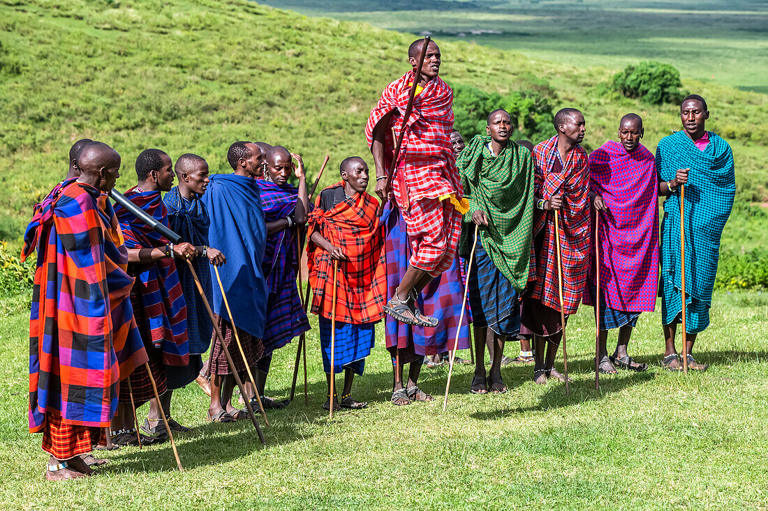 Maasai warriors jump-dancing for a group of tourists in the Ngorongoro Conservation Area,Tanzania