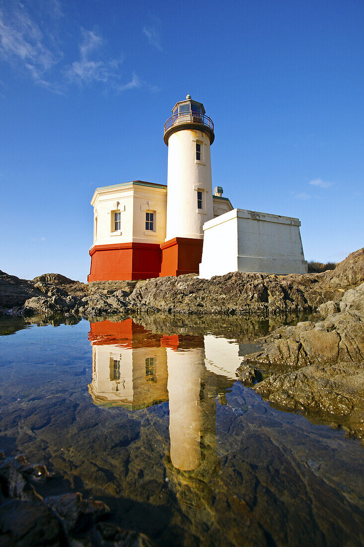 Coquille River Light reflected in a tranquil tide pool,Bullards Beach State Park,Oregon coast,Bandon,Oregon,United States of America