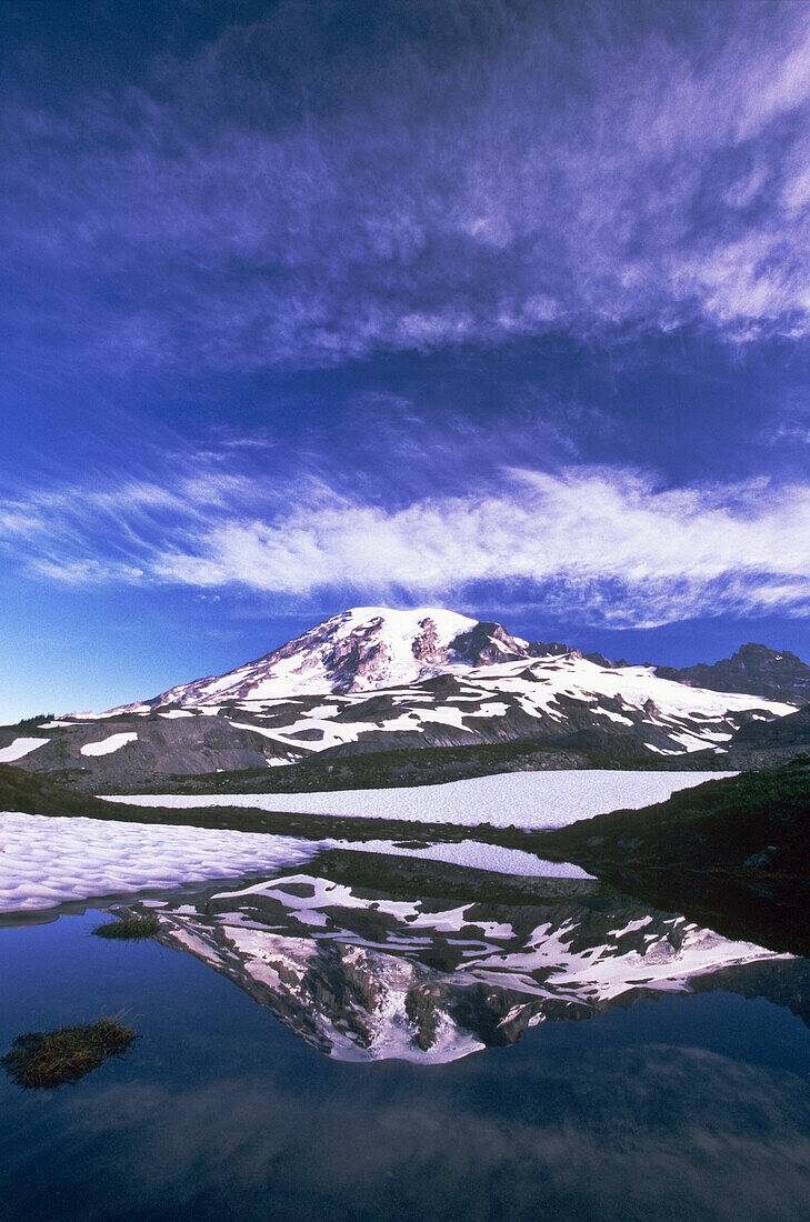 Mount Rainier reflecting in a tranquil pond in Mount Rainier National Park,Washington,United States of America