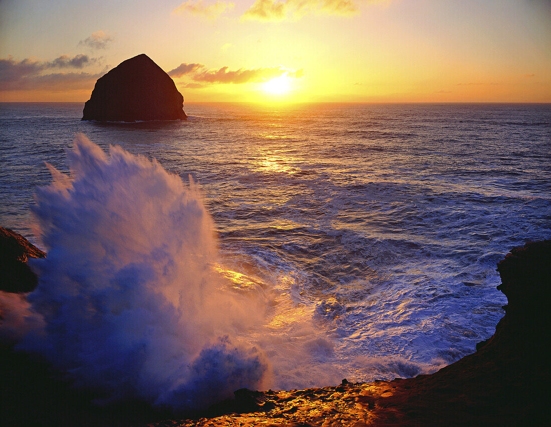 Waves breaking and splashing along the shore at sunset in Ecola State Park,Cannon Beach,Oregon,United States of America