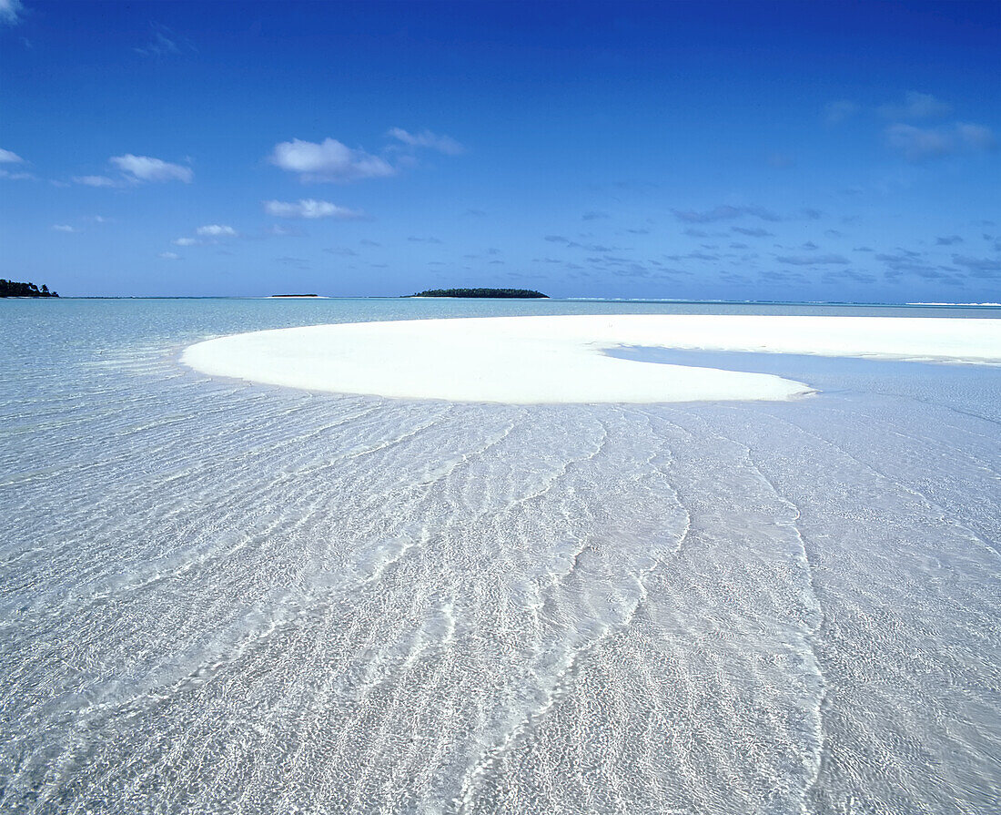 White sandbar surrounded by turquoise ocean water and a blue sky on the horizon in the Cook Islands,Cook Islands